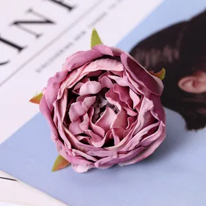 Close-up detail of artificial fabric rose flower head, perfect for DIY crafts and home decor.