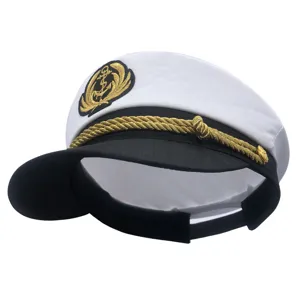 Detailed shot of classic white sailor captain hat with gold braided rope and anchor embroidery.