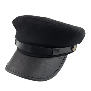 Classic black wool blend women newsboy cap with leather brim and chic side button detail.