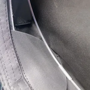 Black police hat inner lining detail showing durable fabric and internal structural support strip.