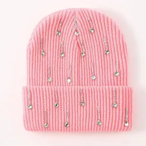 Pink knit beanie hat featuring sparkling rhinestone drops, warm winter cuffed cap