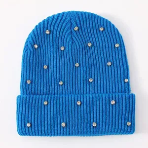 Women's rhinestone knitted beanie hat, blue cuffed winter warm wool pullover cap detail.
