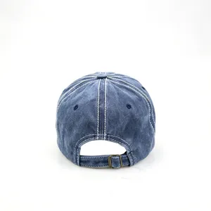 Back detail of vintage washed blue baseball cap with adjustable metal buckle and contrast stitching.