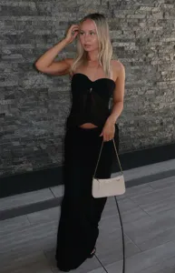 Women's black strapless mesh top and bodycon maxi skirt set, elegant summer fashion outfit.