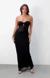Detailed view of the elegant black mesh draped long skirt, showcasing double-layer texture.