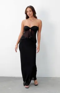 Detail view of the black strapless mesh spliced long dress, showing fabric texture and design.