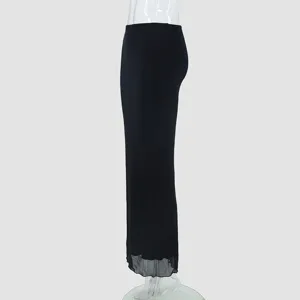 Side detail view of the elegant black double-layer mesh midi skirt showing the sheer hemline.