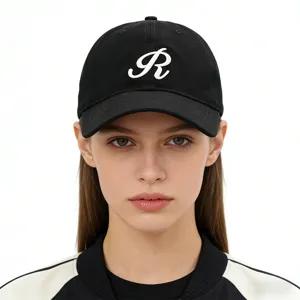 Black cotton baseball cap featuring a white embroidered letter R for casual outdoor wear.