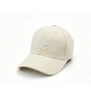 Beige cotton baseball cap with white cursive embroidery, soft top casual hat for men and women.