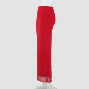 Detail view of the elegant red mesh maxi skirt showing sheer double-layer fabric and drape.