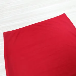 Red mesh skirt fabric detail, showing the fine texture and neat stitching of the red women garment.