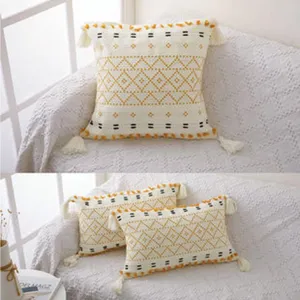 Boho geometric pattern cushion detail view, showing delicate woven texture and cute corner tassels.