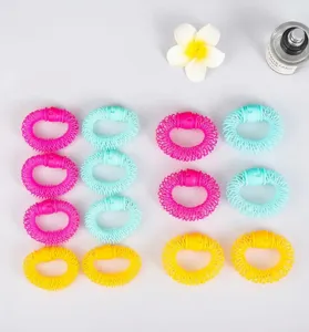 Detail view of colorful plastic donut hair curlers neatly arranged for styling tools.