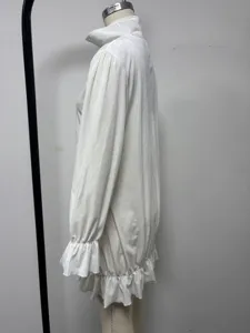 White crystal velvet long sleeve mini dress with half zip mock neck and ruffle cuffs.
