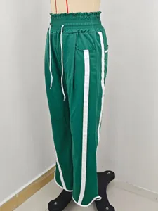 Groene joggingbroek voor dames, witte zijstrepen, hoge elastische taille, comfortabel koord.