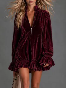 Vintage burgundy velvet mini dress with half-zip stand collar, long ruffled sleeves and flared hem.