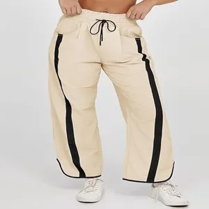 Dames casual losse trekkoordsluiting tonbroek met contrasterende zijstrepen voor sport.