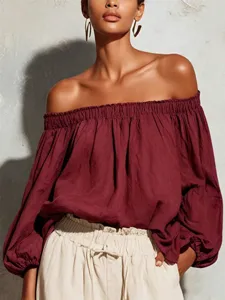 Off-shoulder lantern sleeve detail of casual solid linen blouse, comfortable daily wear.