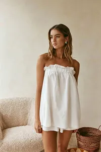 White strapless top and matching shorts set, lightweight summer resort wear detail shot.