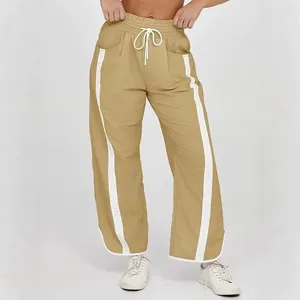 Casual losse sweatpants met trekkoord voor dames met stijlvolle contrasterende zijstrepen.