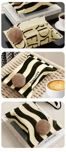 Minimalist fabric tissue box cover with cute plush ball, modern stripes home decor.