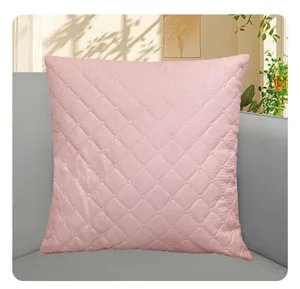 Pink quilted cushion cover, square decorative pillow slip for sofa and living room details.