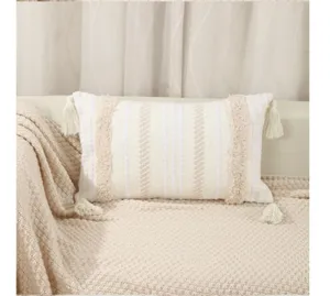 Bohemian woven lumbar pillow with tufted pattern and tassels for cozy home decor and sofa.