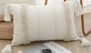 Bohemian Moroccan woven lumbar throw pillow with tassels and tufted texture for sofa bedroom decor.