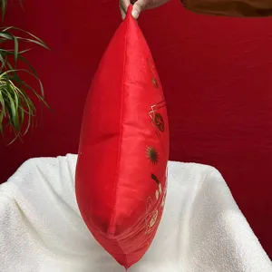 Detailed view of the red plush cushion side, showing thick filling and gold stamping pattern.