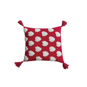 Red tufted heart throw pillow with corner tassels, modern home sofa cushion decor.