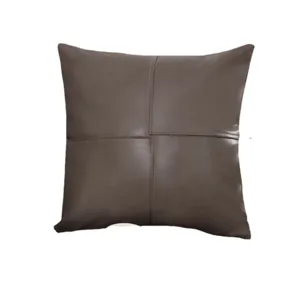 Cuscino decorativo in pelle di lusso tinta unita con cuciture per divano e soggiorno.