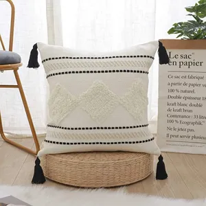 Nordic cotton woven throw pillow cover with tufted diamonds and black tassels for sofa bed.