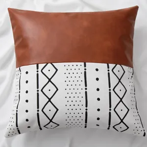 Leather patch pillow cover detail, ethnic geometric pattern design for sofa and bedroom.
