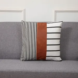 Modern geometric throw pillow cover with leather and striped fabric splicing for living room sofa.