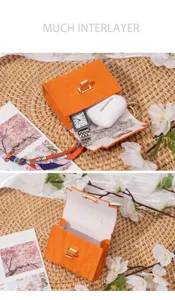 Mini orangefarbene Leder Tasche Schlüsselanhänger Lippenstift Kopfhörertasche mit Metallschnalle.