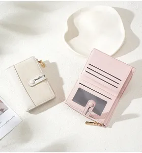 Detailed view of trendy short women's wallets, featuring chic color-block design and card slots.