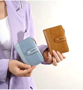 Detail shot of a stylish short color-block wallet featuring card slots and zipper pocket.