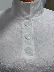 White lace mock neck long sleeve top with half button placket detail, elegant daily style.