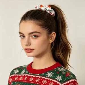 Christmas satin hair scrunchie detail view, festive red and orange print hair accessory.
