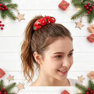 Christmas hair scrunchie detail view showcasing festive red fabric with cute holiday prints.
