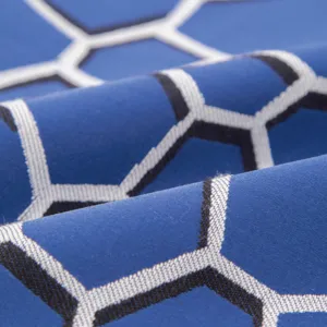 Tessuto per federa jacquard geometrico esagonale blu di alta precisione vista dettaglio.