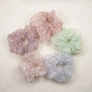Floral chiffon scrunchies detail view, sweet spring hair ties for women and girls ponytail style.