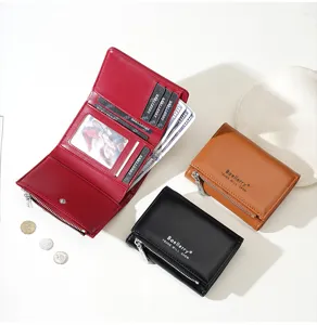Detailed view of women's short trifold wallet with multiple card slots and zipper coin pocket.