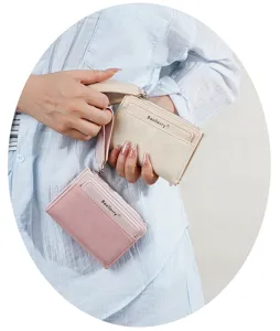 Close-up of women's short colorblock wallet with wrist strap, multiple card slots zipper.