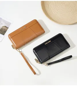 Close up of long PU leather wallets with wrist strap, zipper closure and metal logo detail.