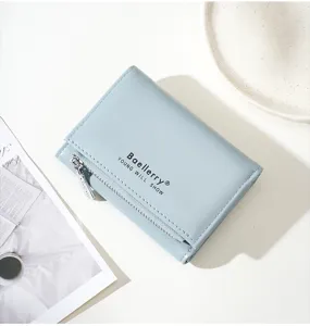 Light blue trifold short women's wallet detail, compact PU leather card holder with coin zipper.