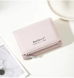 Pink trifold short wallet for women, compact PU leather card holder with zipper pocket detail.
