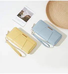 Solid color long women clutch wallet with zipper and wrist strap, multi card slot detail.