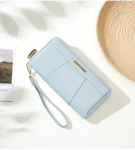 Solid color women's long clutch wallet with zipper, wrist strap, and multiple card slots.