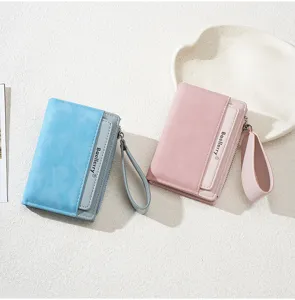 Detail view of stylish short women zipper coin purse with multi card slots and wrist strap.